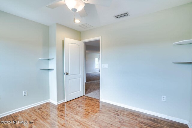 spare room with ceiling fan and light hardwood / wood-style flooring