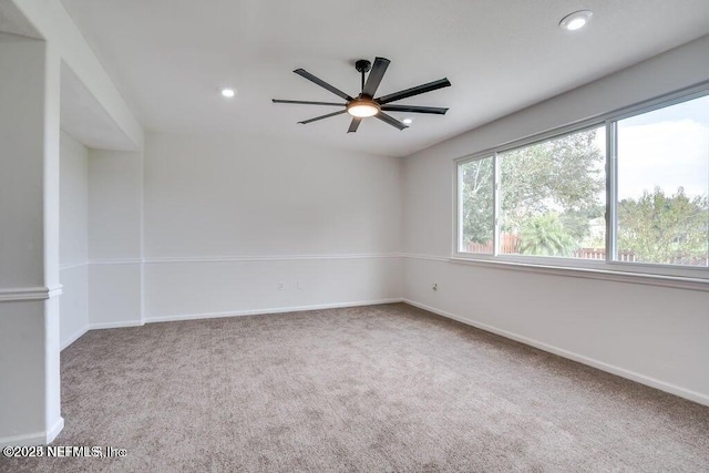 carpeted empty room with ceiling fan