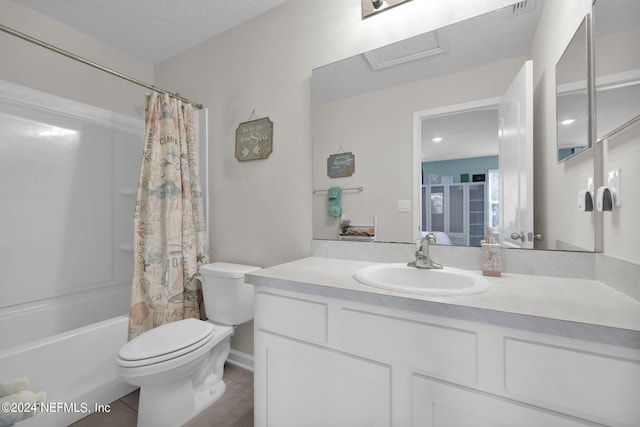 full bathroom with vanity, toilet, shower / bath combo, a textured ceiling, and tile patterned flooring