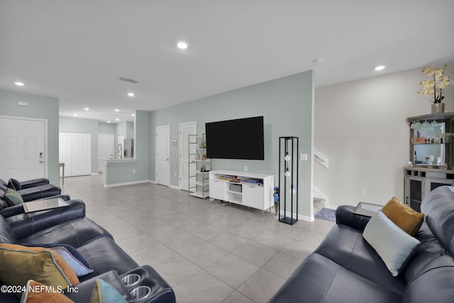 living room with light tile patterned flooring