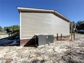 view of home's exterior with central AC unit