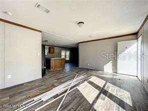 unfurnished living room featuring dark hardwood / wood-style flooring