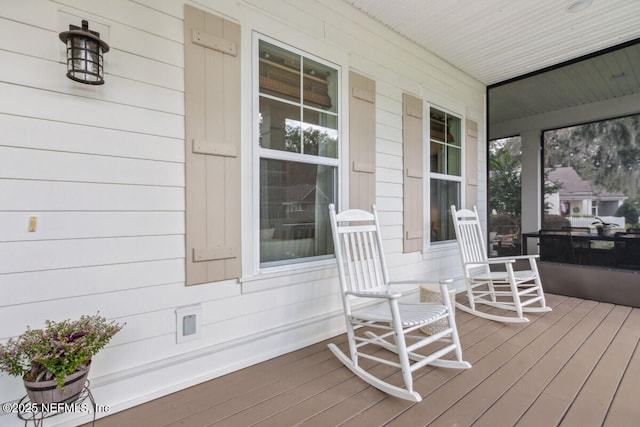 wooden deck featuring covered porch