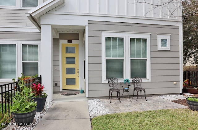 doorway to property with a patio area