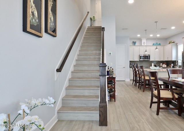 staircase featuring hardwood / wood-style flooring