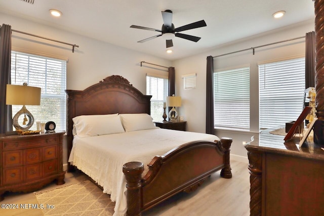 bedroom featuring ceiling fan and light hardwood / wood-style flooring