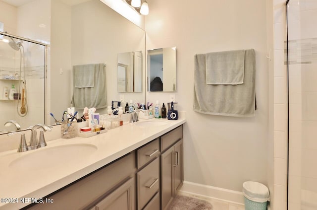 bathroom featuring tile patterned floors, vanity, and an enclosed shower