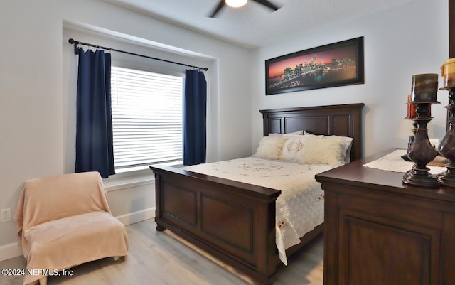 bedroom featuring ceiling fan and light wood-type flooring