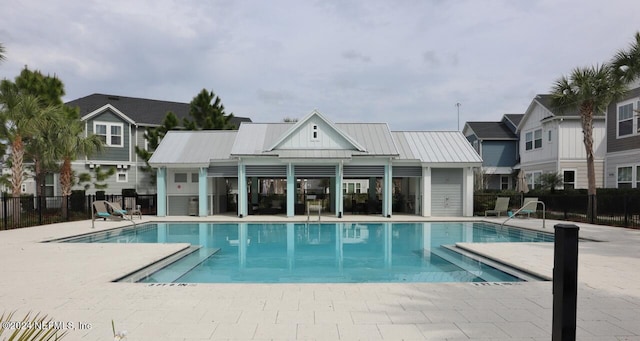 view of swimming pool featuring a patio area