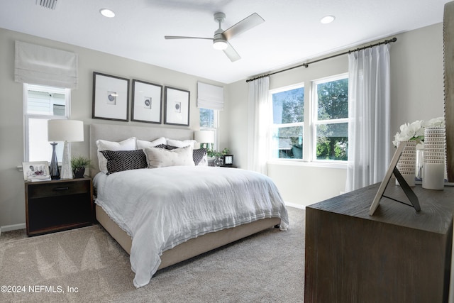 bedroom featuring ceiling fan and light colored carpet