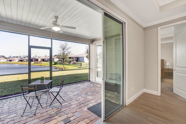 sunroom featuring ceiling fan