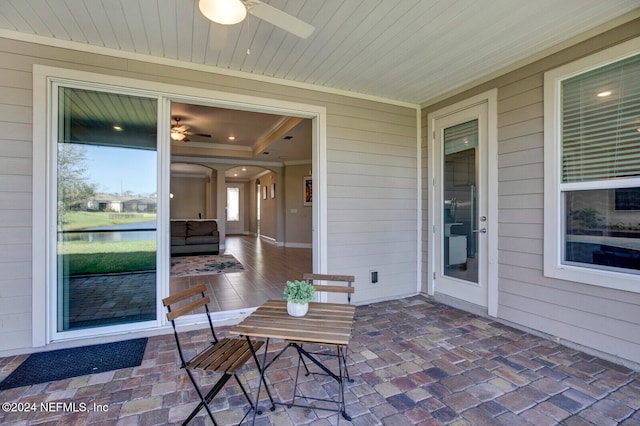 sunroom / solarium featuring wood ceiling