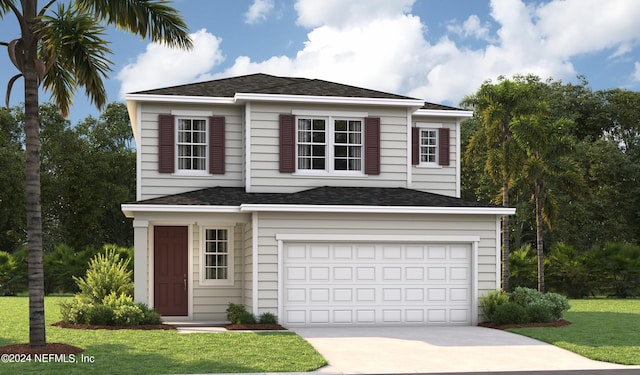 view of front of home with a garage and a front lawn