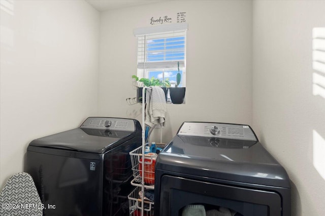 clothes washing area with separate washer and dryer