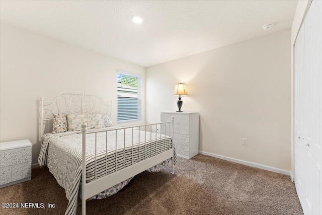 carpeted bedroom featuring a closet