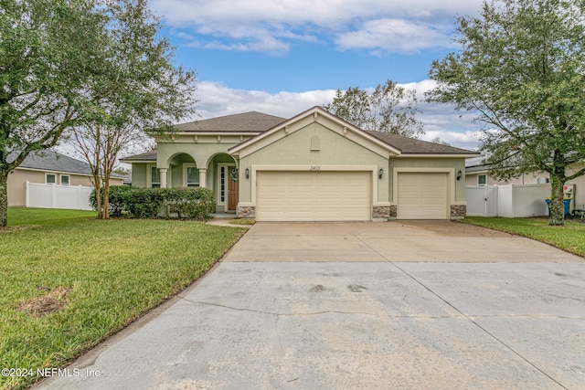 view of front facade featuring a garage and a front yard