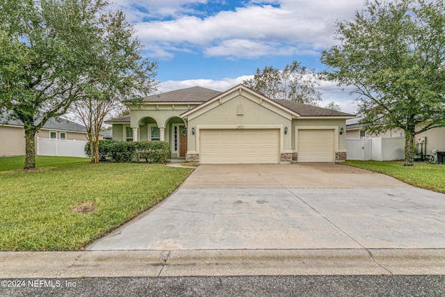 view of front facade featuring a garage and a front yard