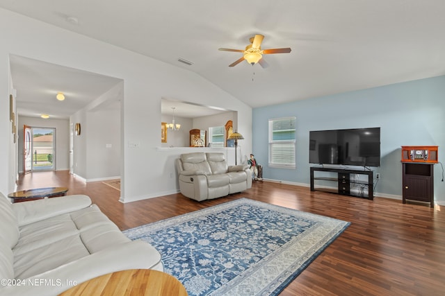 living room featuring hardwood / wood-style floors, ceiling fan with notable chandelier, and vaulted ceiling