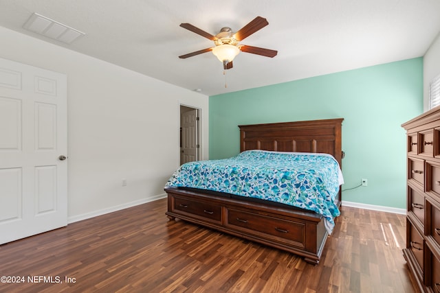 bedroom featuring dark hardwood / wood-style floors and ceiling fan