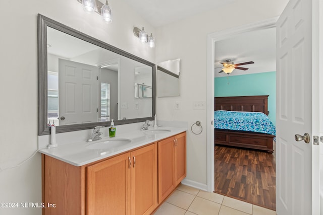 bathroom featuring vanity, hardwood / wood-style floors, and ceiling fan