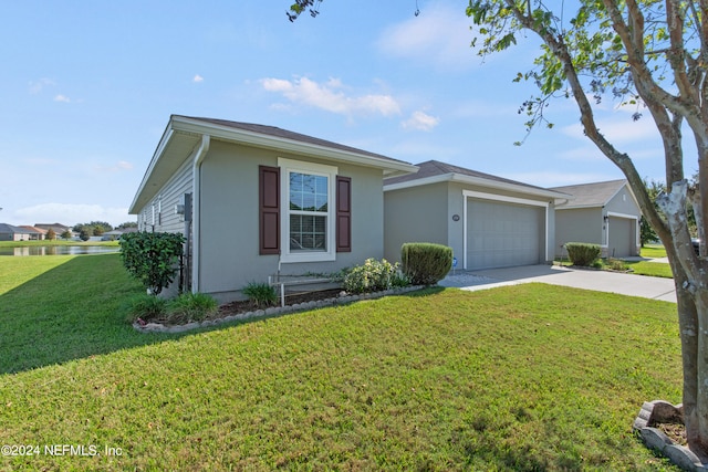 single story home with a front yard and a garage