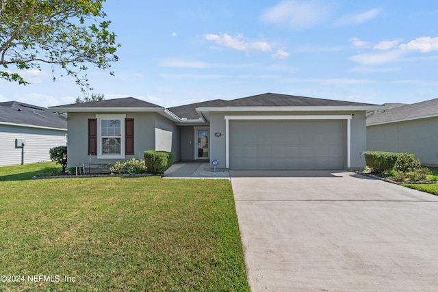 single story home with a garage and a front lawn