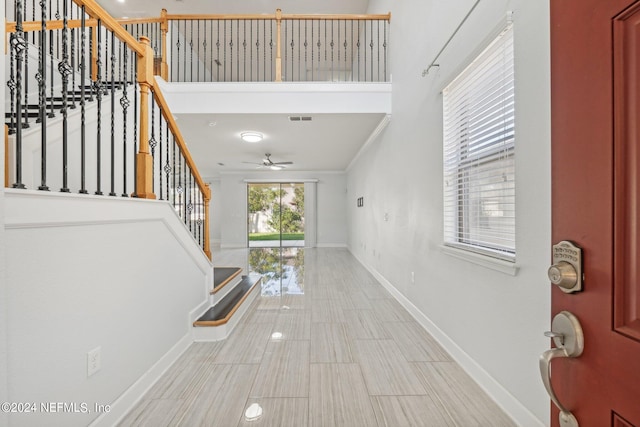 entryway featuring ceiling fan