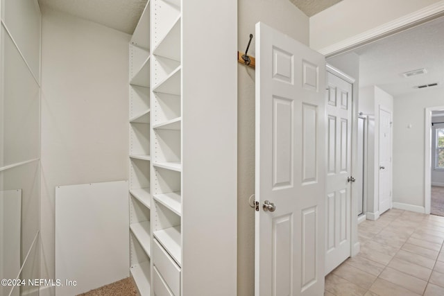 interior space featuring light tile patterned flooring