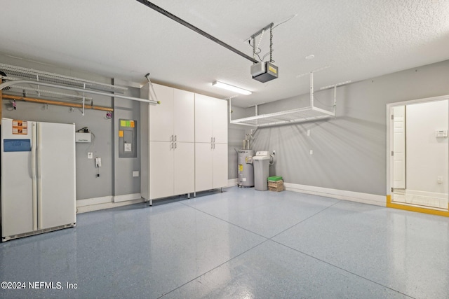 garage featuring white refrigerator, electric panel, a garage door opener, and water heater