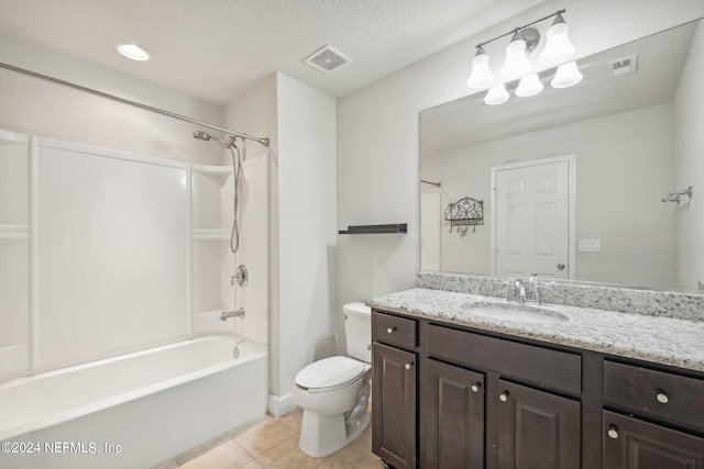 full bathroom featuring vanity, tile patterned floors, bathtub / shower combination, toilet, and a textured ceiling