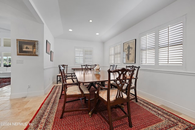 dining room with lofted ceiling