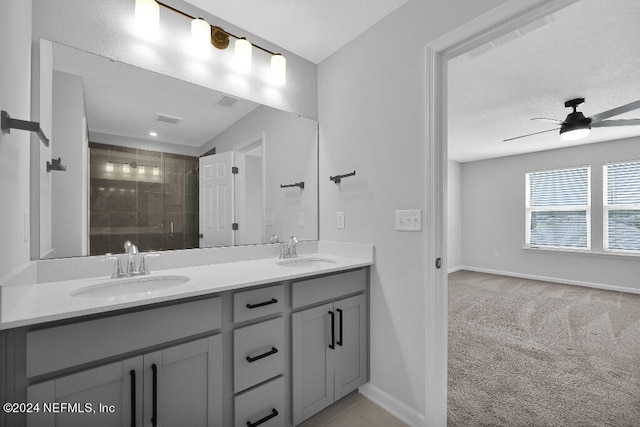 bathroom featuring ceiling fan and vanity