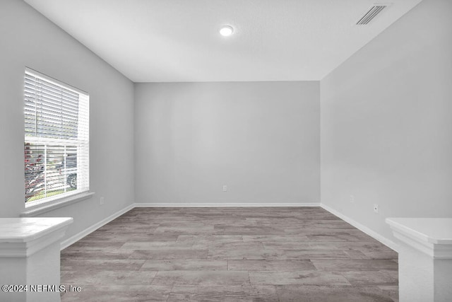 unfurnished room featuring light hardwood / wood-style floors