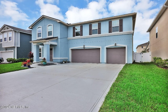 view of front property with a front lawn and a garage