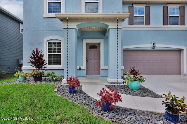 view of front of property with a garage