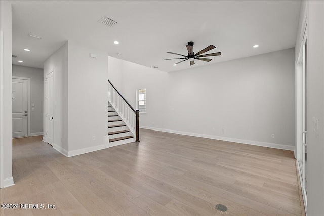 interior space with light wood-type flooring and ceiling fan