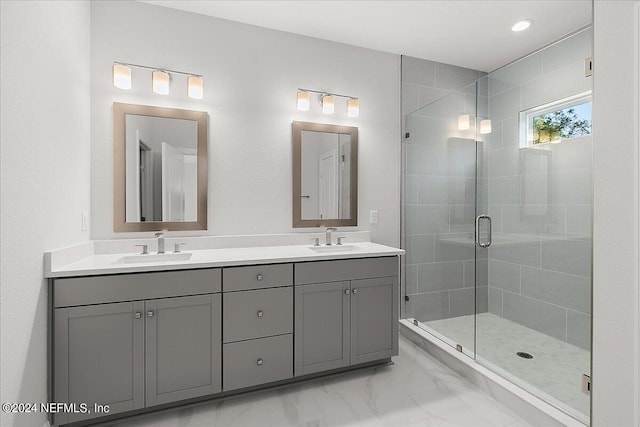 bathroom featuring vanity and an enclosed shower