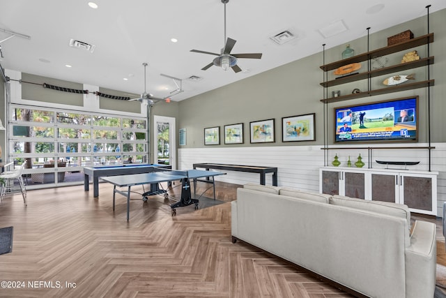 recreation room featuring ceiling fan and parquet floors