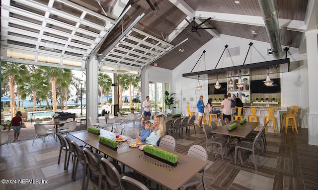 interior space featuring an outdoor bar and ceiling fan