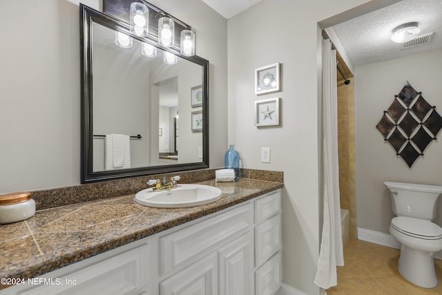 full bathroom featuring shower / tub combo, a textured ceiling, toilet, tile patterned floors, and vanity