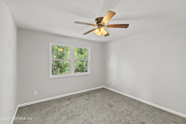 unfurnished room with a textured ceiling, carpet flooring, and ceiling fan