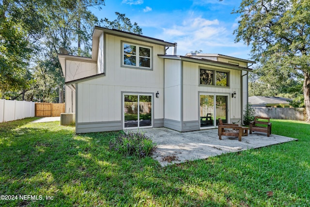 back of property featuring a patio, a yard, and central air condition unit