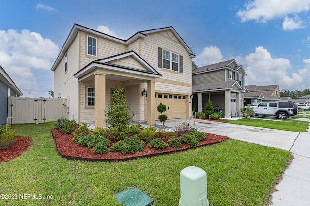 view of front facade featuring a front yard and a garage