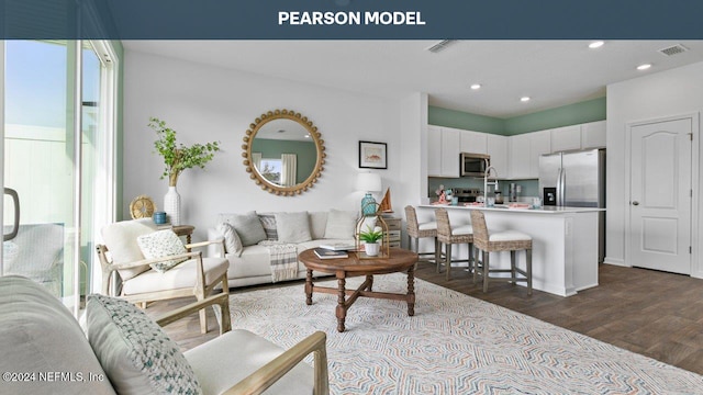 living room featuring dark wood-type flooring