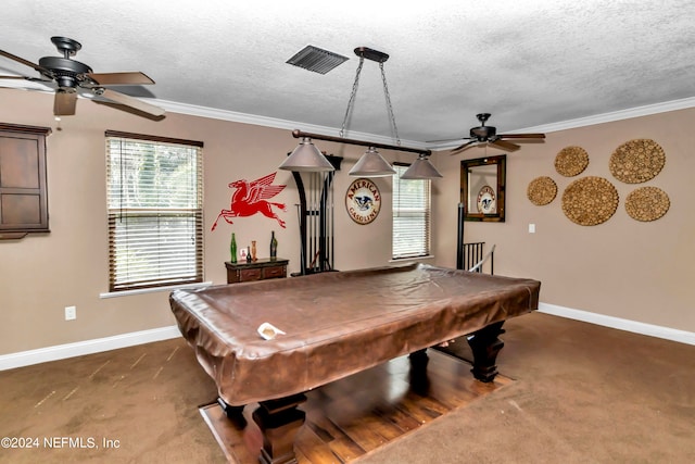 playroom with crown molding, dark carpet, and a textured ceiling