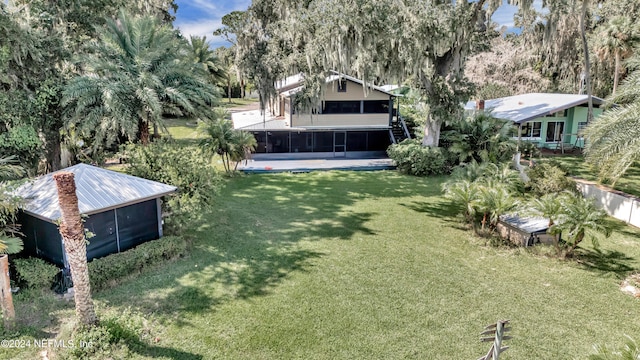 view of yard featuring a sunroom