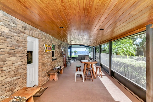 unfurnished sunroom featuring wooden ceiling