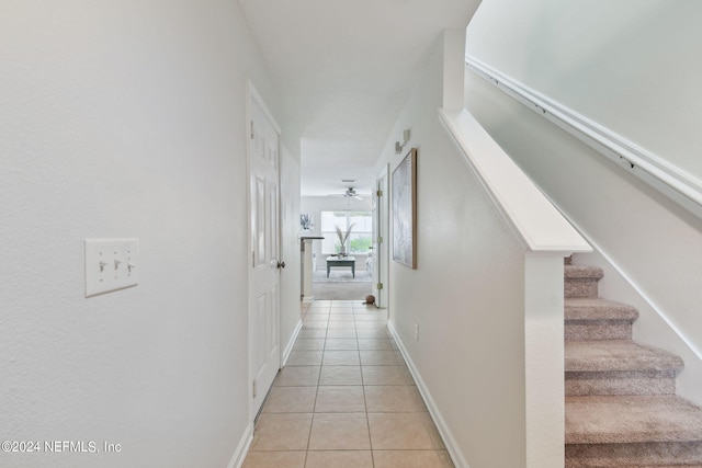 hall with light tile patterned flooring