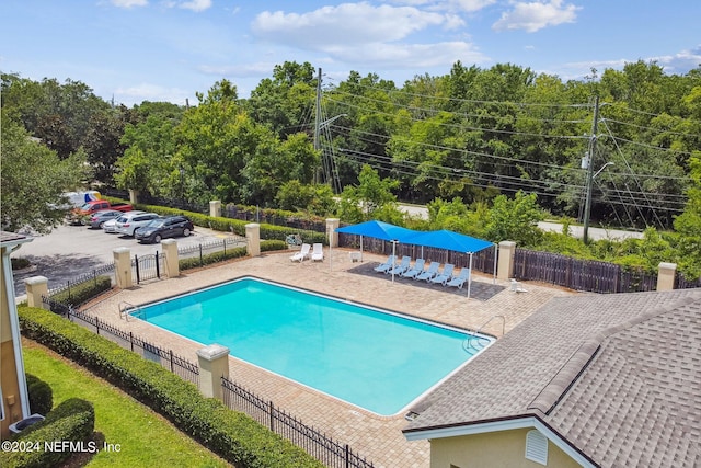 view of swimming pool featuring a patio