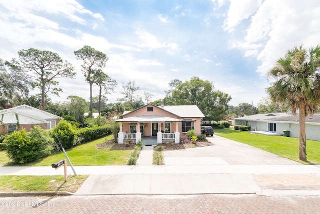 view of front of home featuring a front lawn and a porch